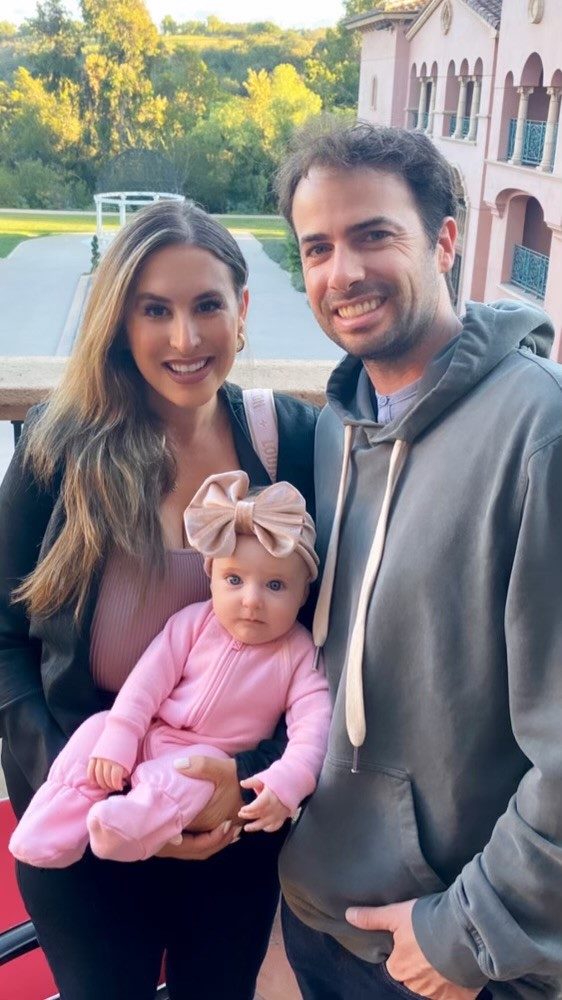 Danny, owner of Palms Place, with his wife and daughter