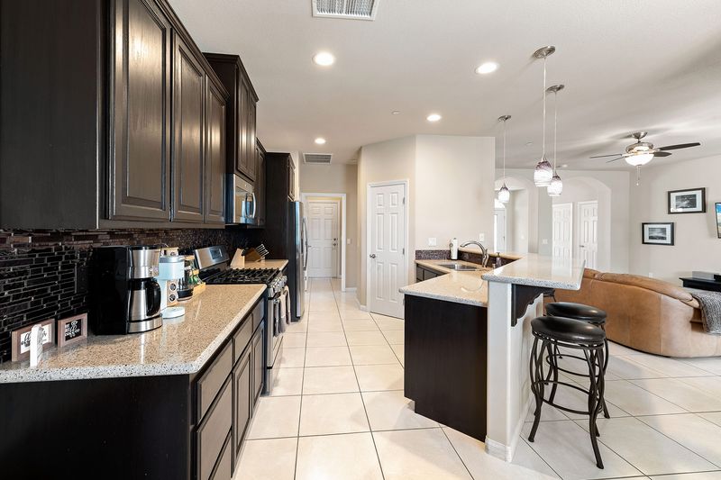 Kitchen island open to the living area at Palms Place