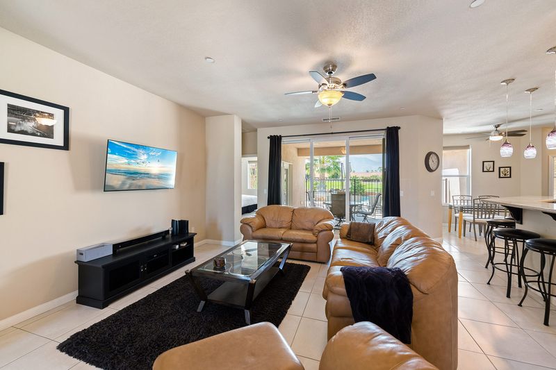 Living room sectional and TV at Palms Place