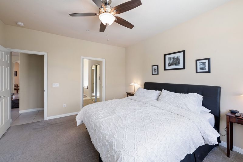 Primary suite with king bed at Palms Place vacation rental Indio