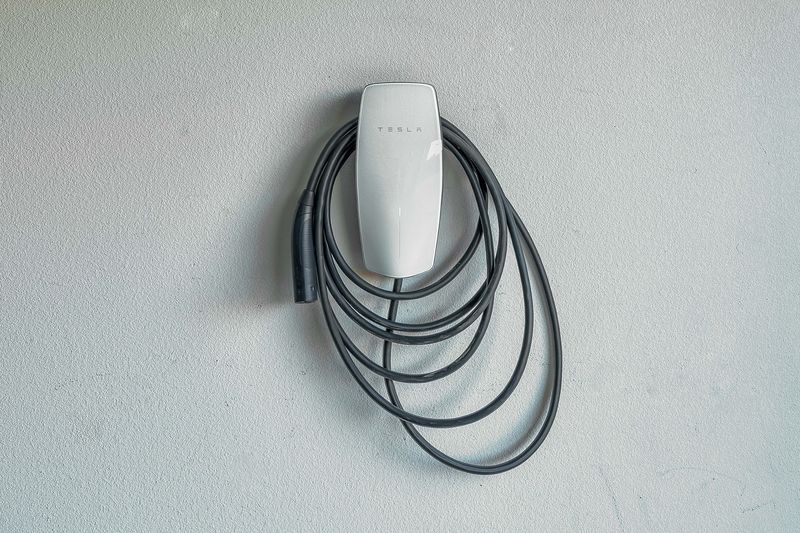 Tesla Wall Connector EV charger in the garage at Palms Place Indio